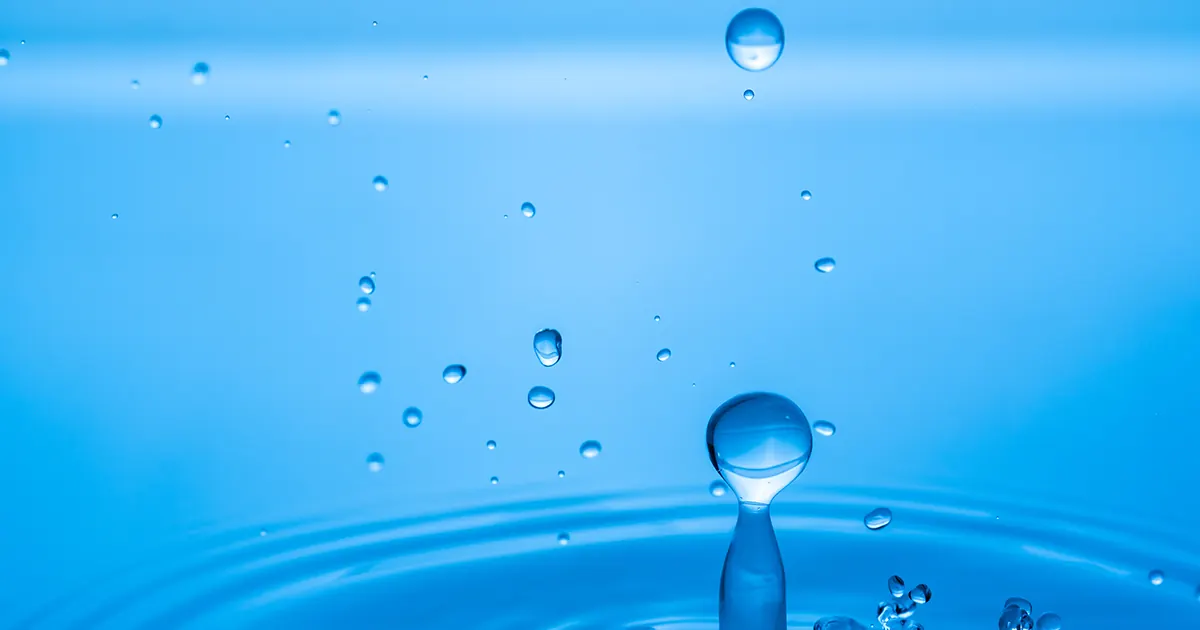 Droplets from a splash in still water