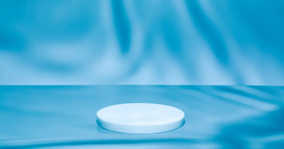 White podium in blue watery surroundings and background