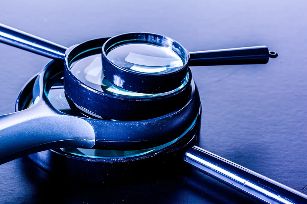 ai-governance-readiness-assessment Magnifying glasses stacked on top of each other in ever-decreasing sizes