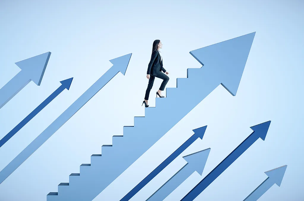 test-process-maturity-survey A woman climbs a staircase in the direction of the upward-pointing arrows on either side of her